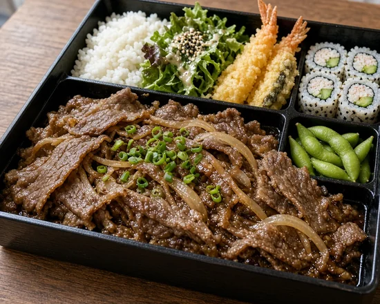 Bulgogi bento box with sliced marinated beef and onion, rice, salad, shrimp tempura, California roll and edamame, with a bowl of miso soup